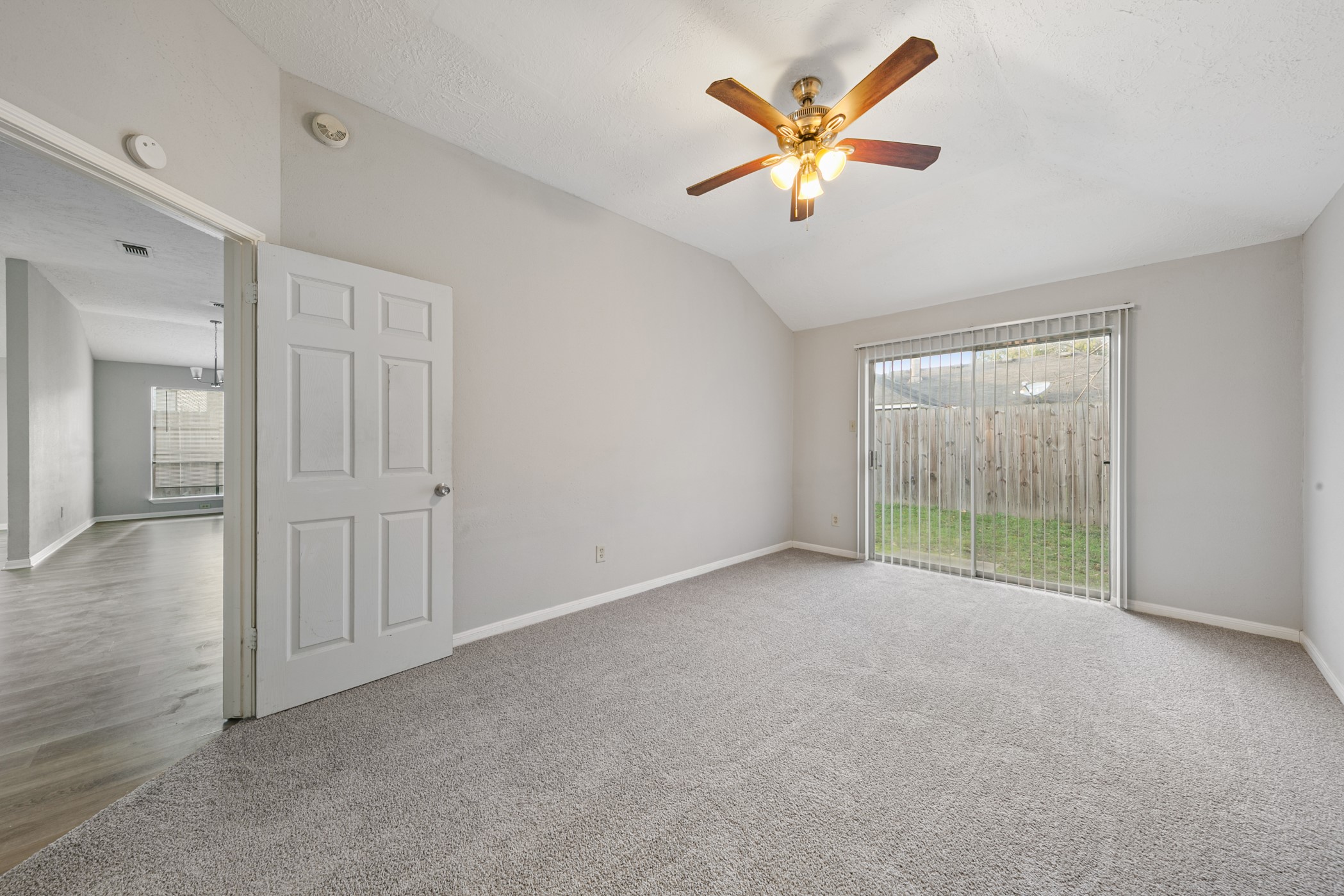 10530 Rippling Fields Drive Houston, TX 77064 - Photo 19 of 29 an empty room with fan and windows