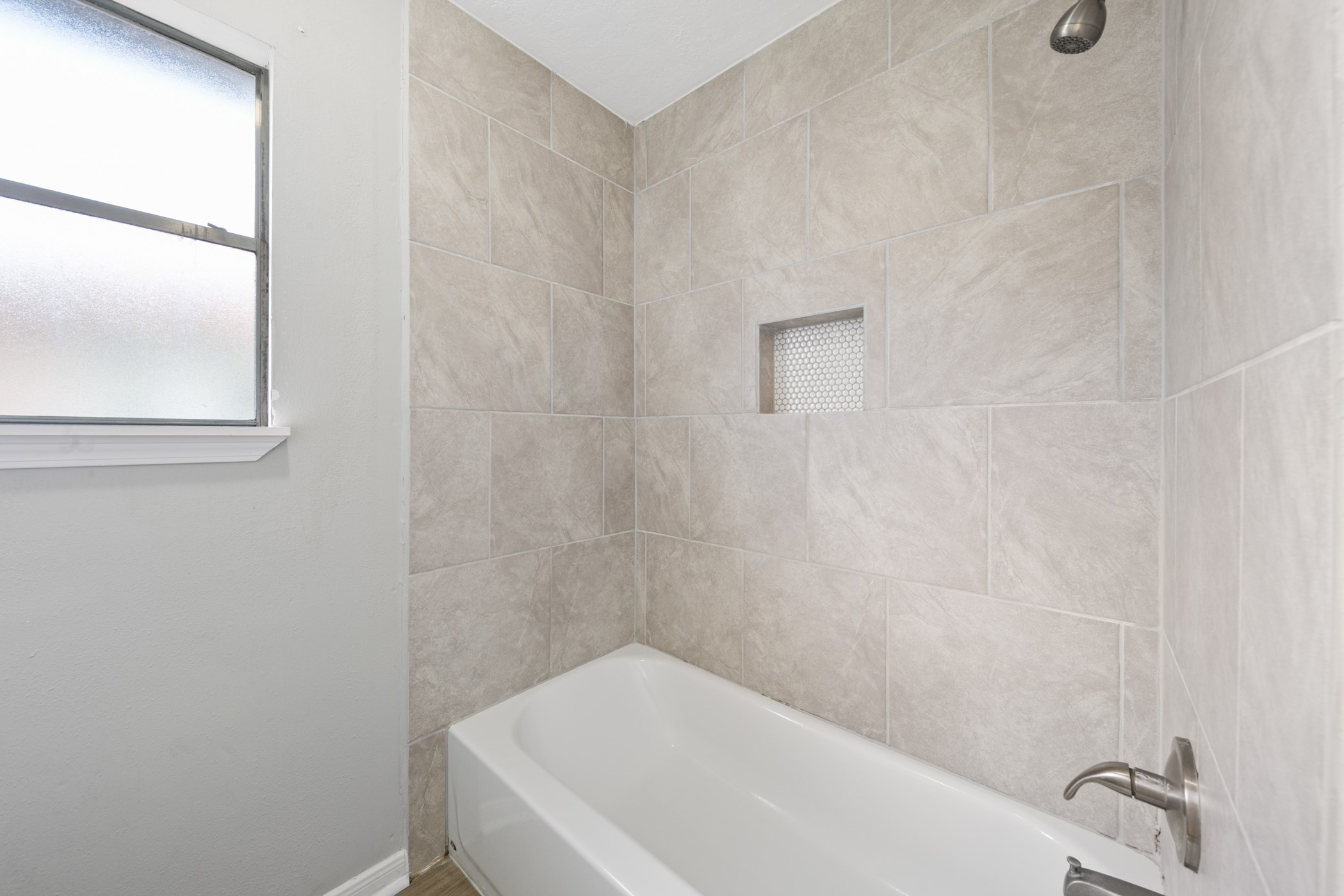 10530 Rippling Fields Drive Houston, TX 77064 - Photo 22 of 29 a bathroom with a bathtub