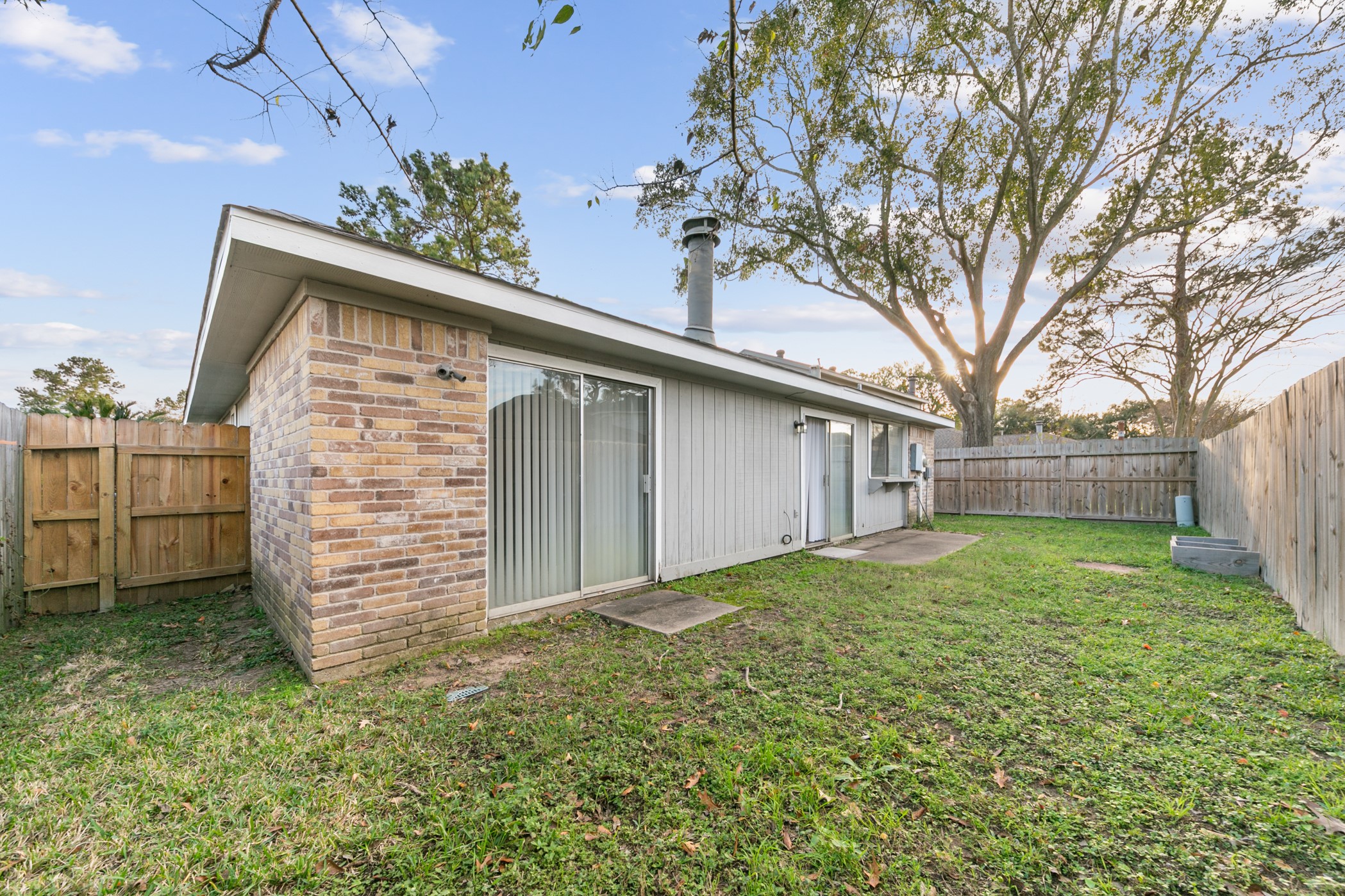 10530 Rippling Fields Drive Houston, TX 77064 - Photo 29 of 29 a backyard of a house with lots of green space