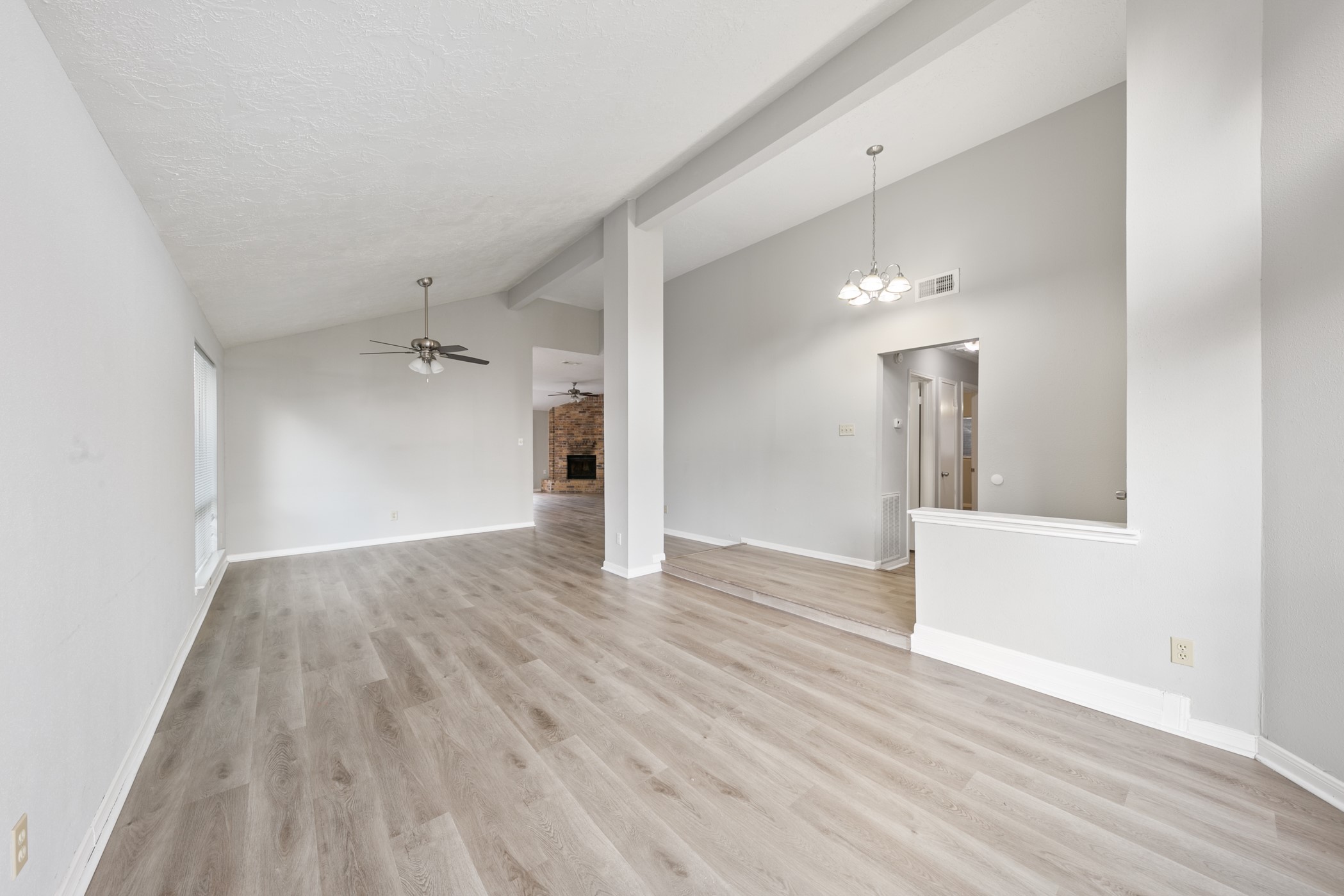 10530 Rippling Fields Drive Houston, TX 77064 - Photo 8 of 29 wooden floor in an empty room with a window