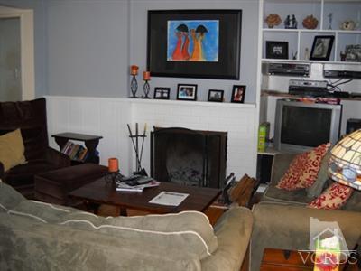1018 West Roderick Avenue Oxnard, CA 93030 - Photo 4 of 7 a living room with furniture and a fireplace