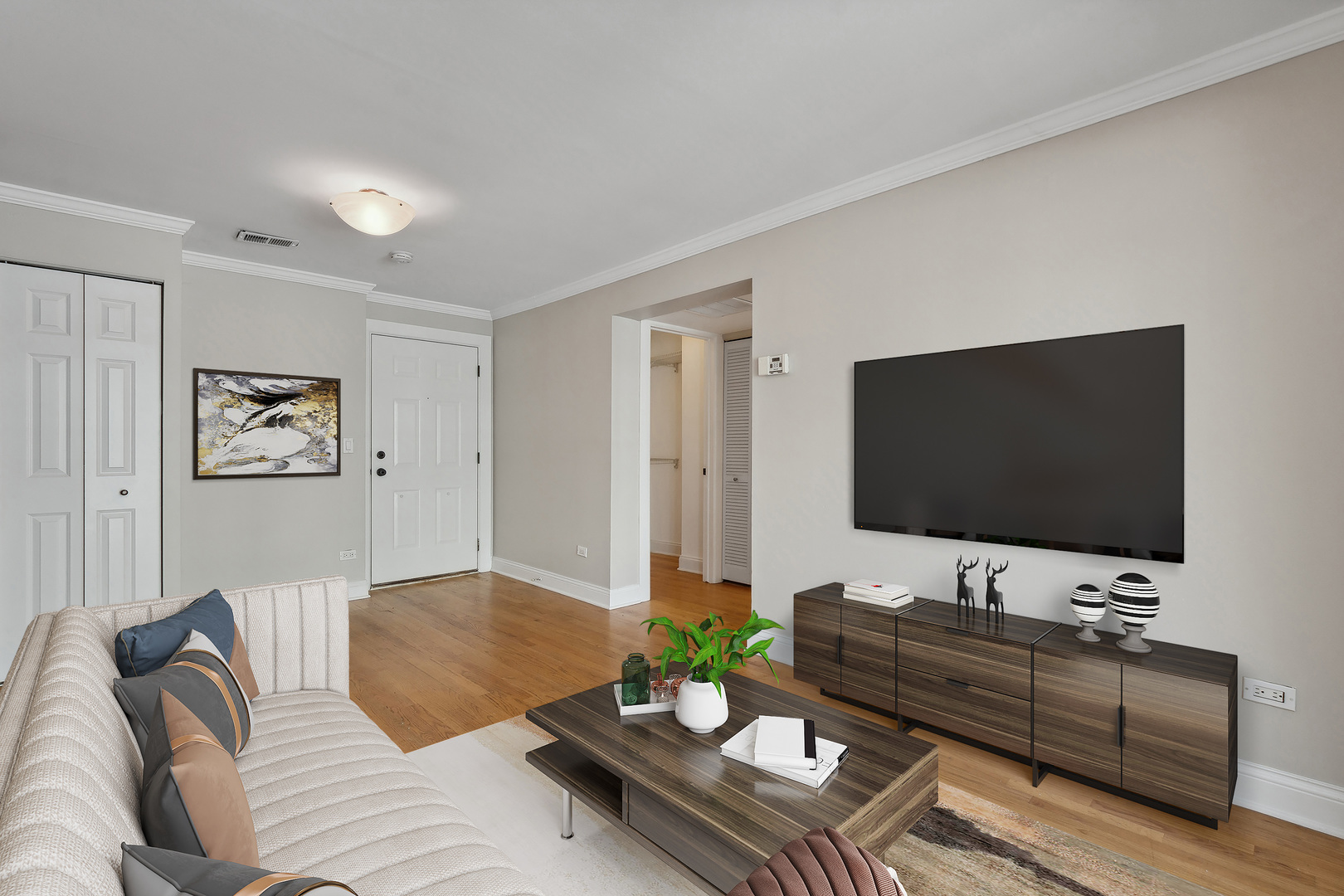 4144 North Sheridan Road, Unit 205 Chicago, IL 60613 - Photo 5 of 18 a living room with furniture and a flat screen tv