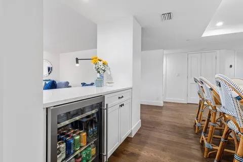 a view of cabinets with wooden floor and furniture
