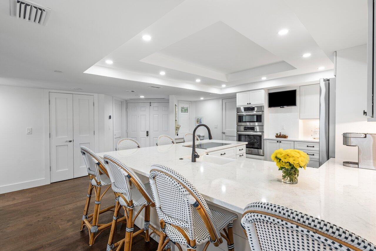 176 Helios Drive, Unit 104 Jupiter, FL 33477 - Photo 17 of 59 a view of kitchen with dining area