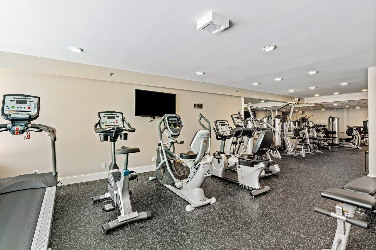 176 Helios Drive, Unit 104 Jupiter, FL 33477 - Photo 21 of 59 a view of a room with gym equipment