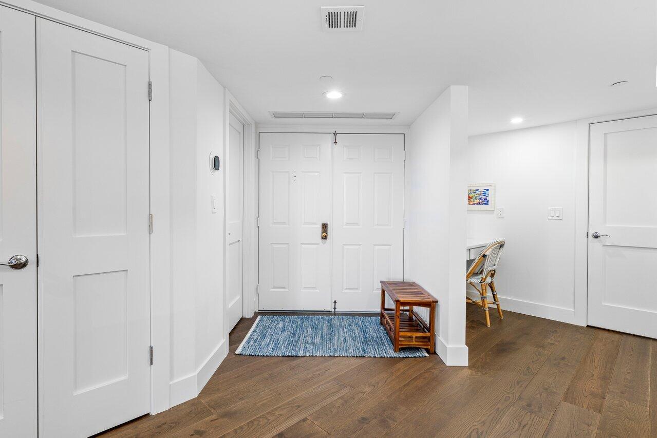 176 Helios Drive, Unit 104 Jupiter, FL 33477 - Photo 23 of 59 a view of a livingroom with furniture and hardwood floor