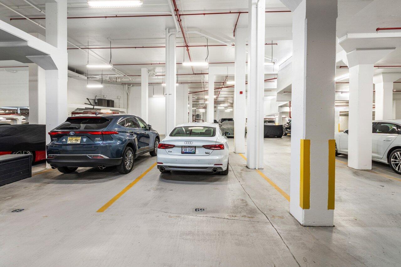 176 Helios Drive, Unit 104 Jupiter, FL 33477 - Photo 27 of 59 a car parked in front of a building