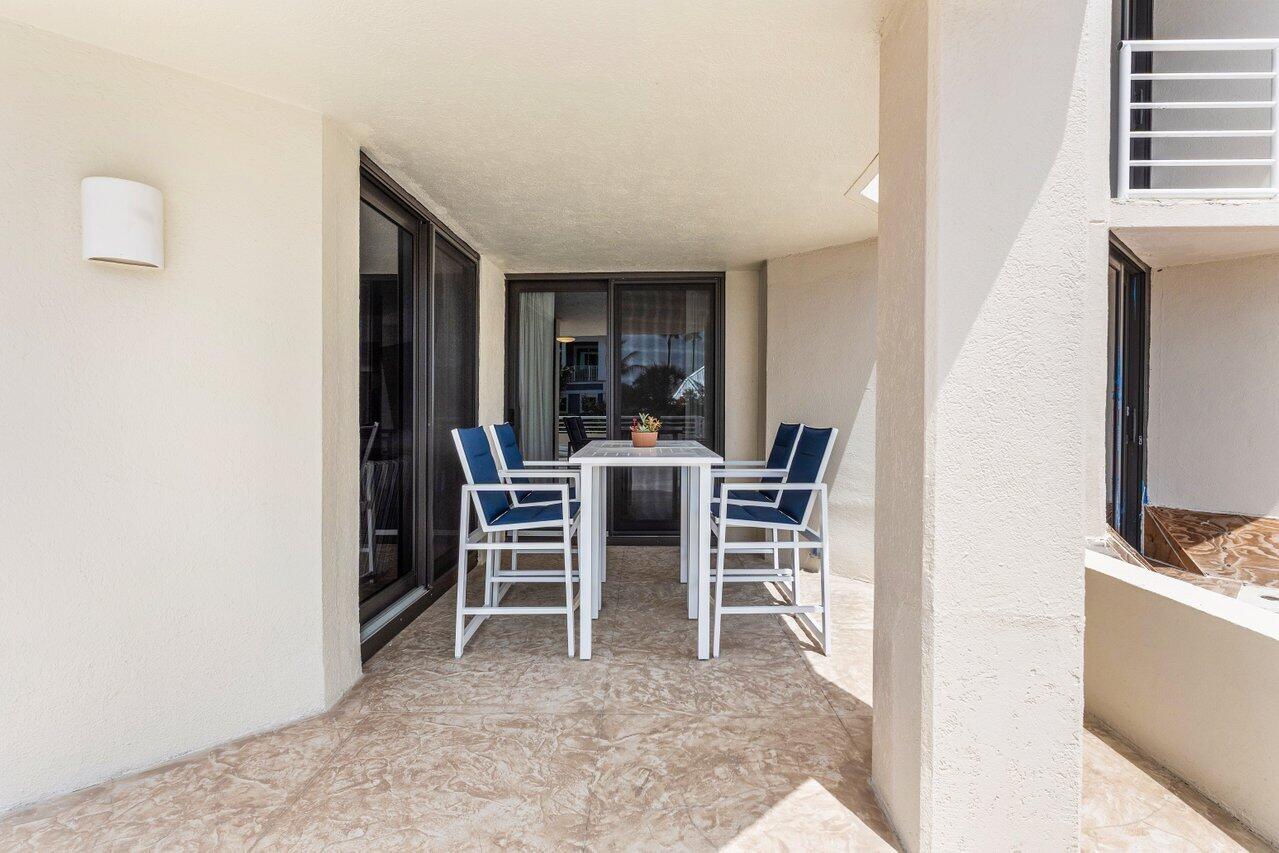 176 Helios Drive, Unit 104 Jupiter, FL 33477 - Photo 39 of 59 a view of a dining room with furniture and window