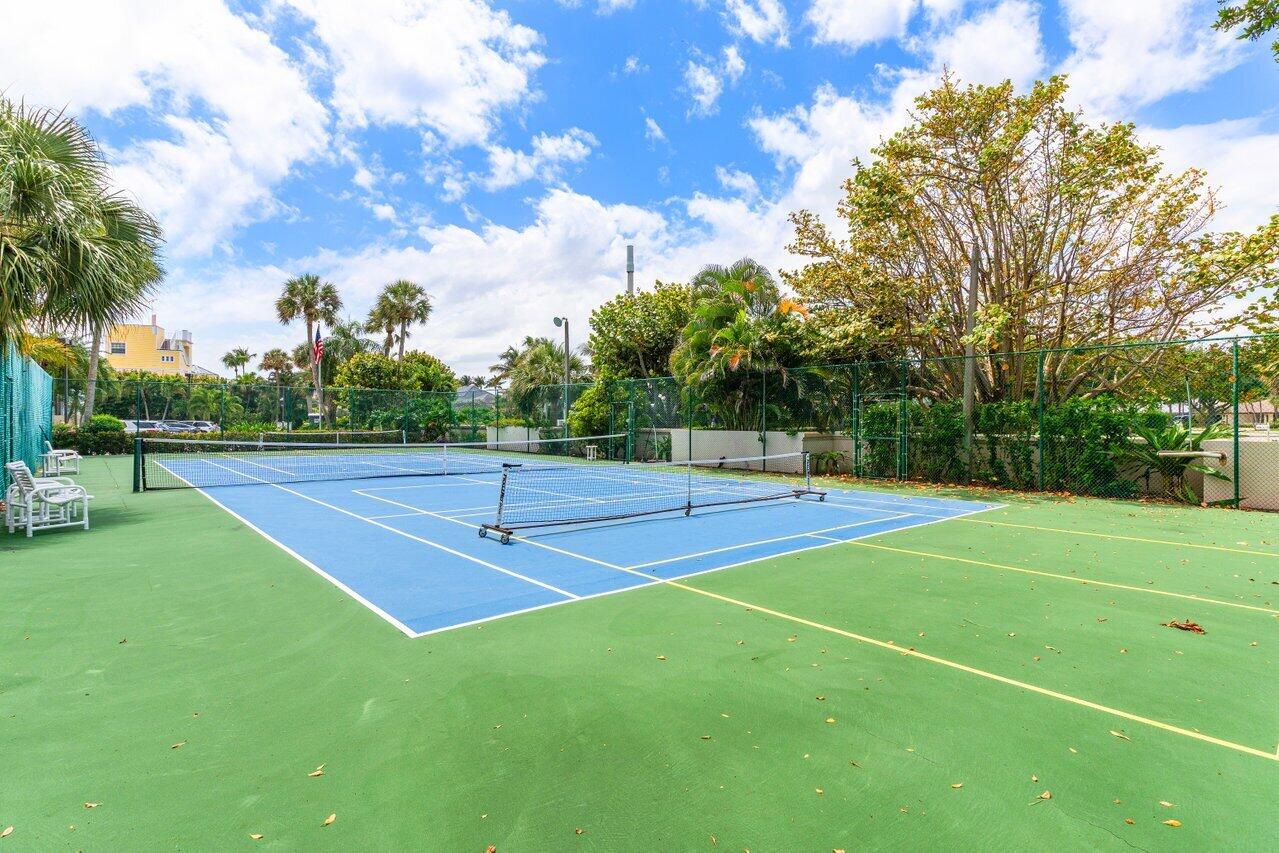 176 Helios Drive, Unit 104 Jupiter, FL 33477 - Photo 49 of 59 a view of a tennis court