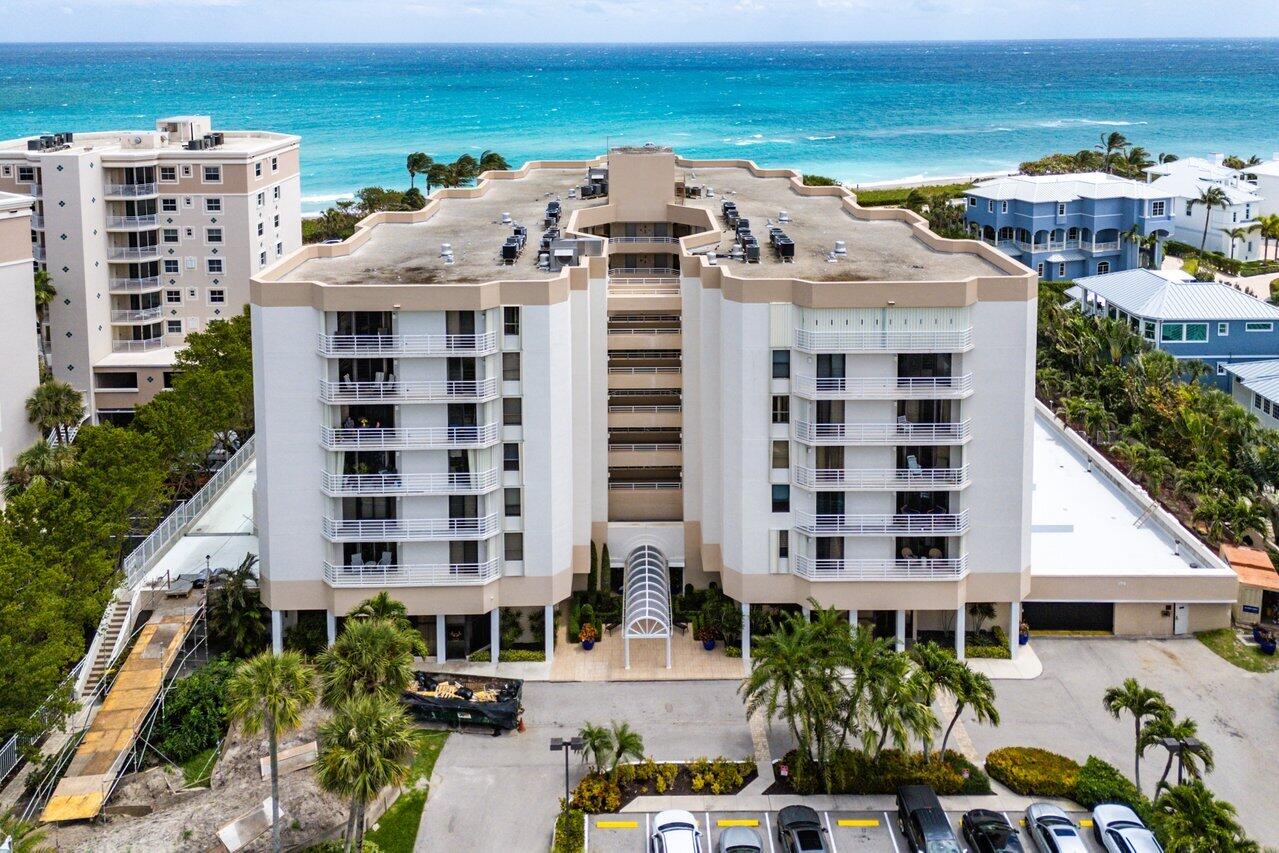 176 Helios Drive, Unit 104 Jupiter, FL 33477 - Photo 50 of 59 a view of a large building with a outdoor space