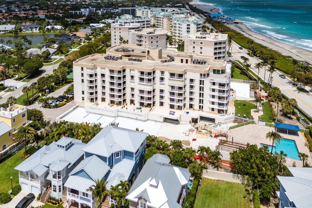 176 Helios Drive, Unit 104 Jupiter, FL 33477 - Photo 56 of 59 an aerial view of residential houses with yard