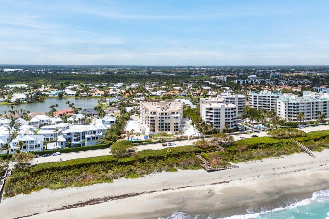 176 Helios Drive, Unit 104 Jupiter, FL 33477 - Photo 58 of 59 an aerial view of a city with lots of residential buildings