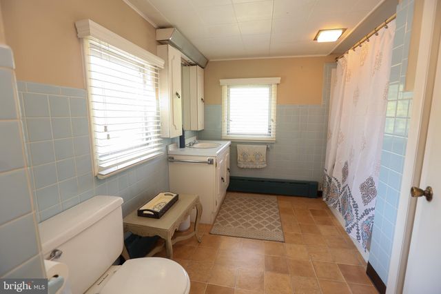 a bathroom with a toilet sink and a bathtub