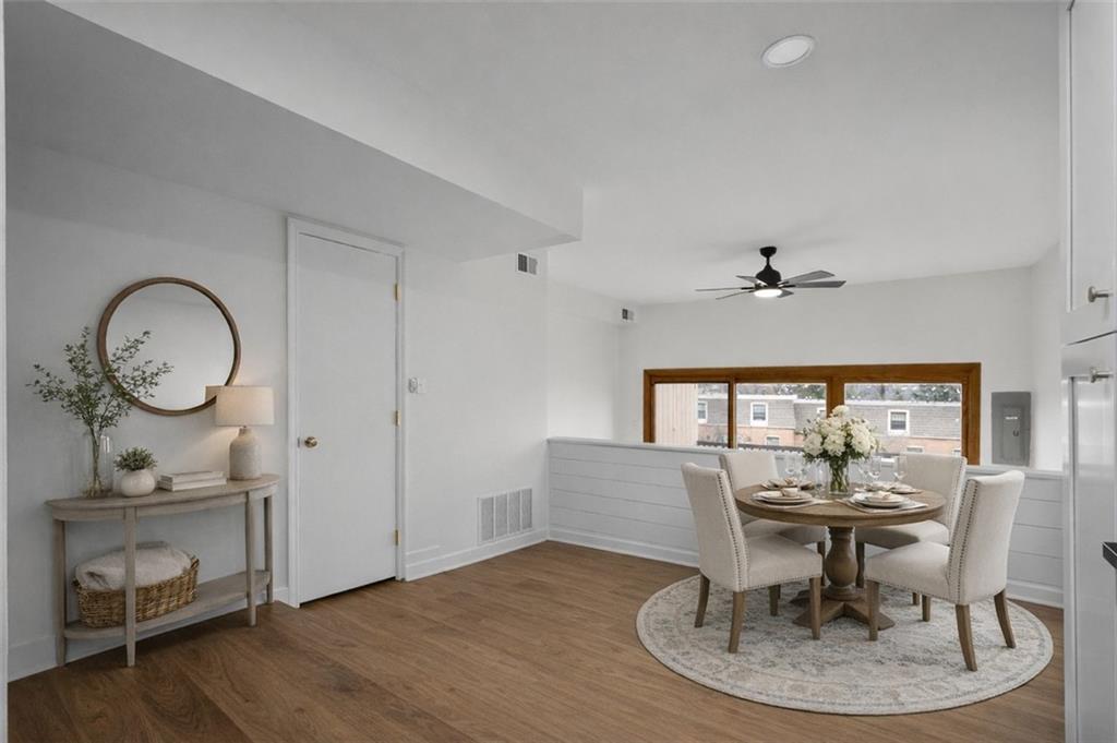 139 Community Court Pittsburgh, PA 15205 - Photo 12 of 32 a dining room with wooden floor a glass table and chairs