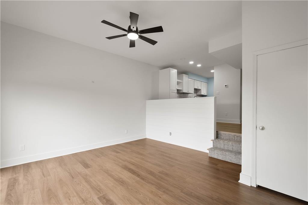 139 Community Court Pittsburgh, PA 15205 - Photo 17 of 32 an empty room with wooden floor and a ceiling fan