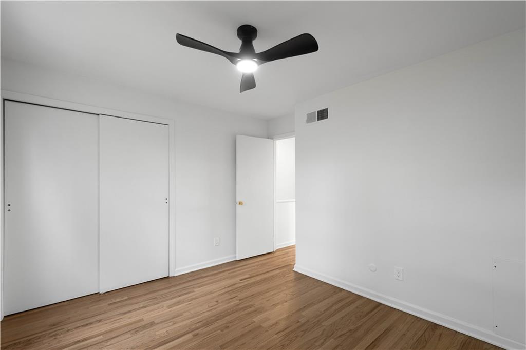 139 Community Court Pittsburgh, PA 15205 - Photo 19 of 32 a view of an empty room with wooden floor
