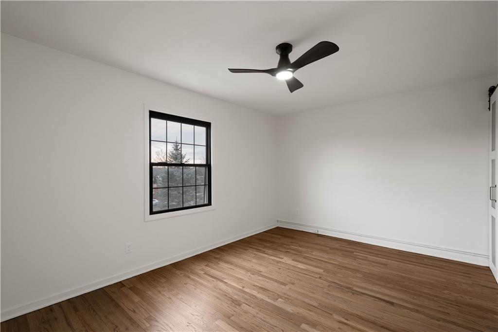 139 Community Court Pittsburgh, PA 15205 - Photo 23 of 32 wooden floor in an empty room with a window