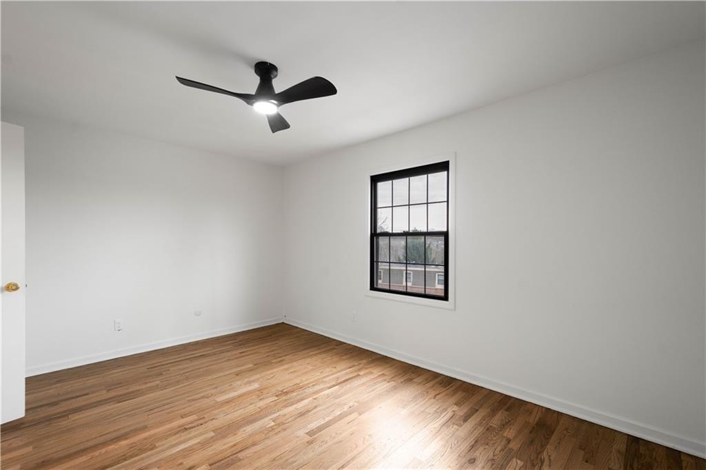 139 Community Court Pittsburgh, PA 15205 - Photo 25 of 32 a view of empty room with wooden floor and fan