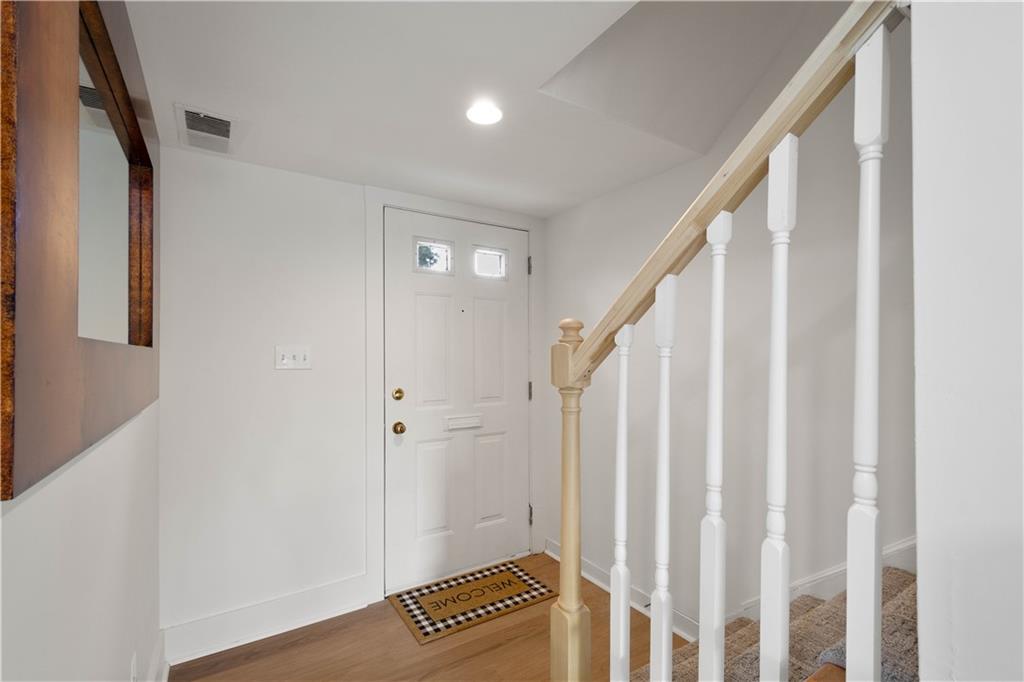 139 Community Court Pittsburgh, PA 15205 - Photo 5 of 32 a view of a hallway with wooden floor and staircase