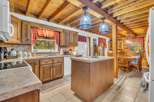 a kitchen with stainless steel appliances granite countertop a sink and cabinets