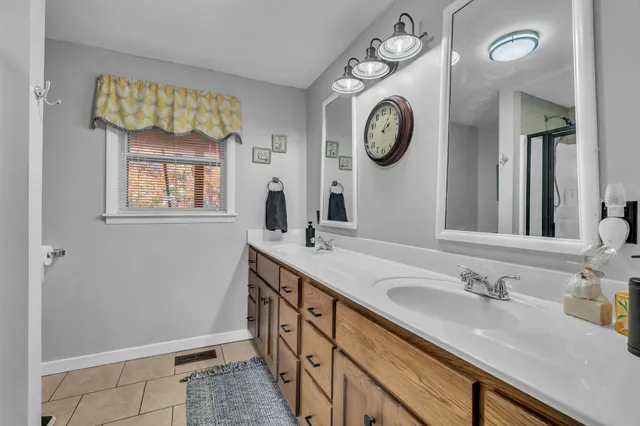 a bathroom with a sink and a large mirror