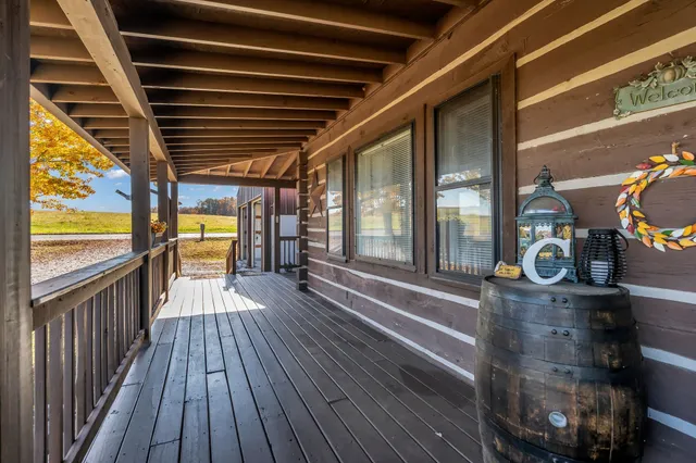 a view of a porch with wooden floor