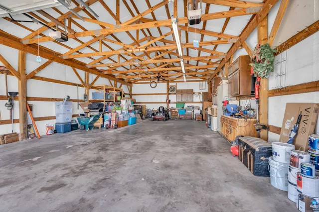 a view of a parking area with a garage