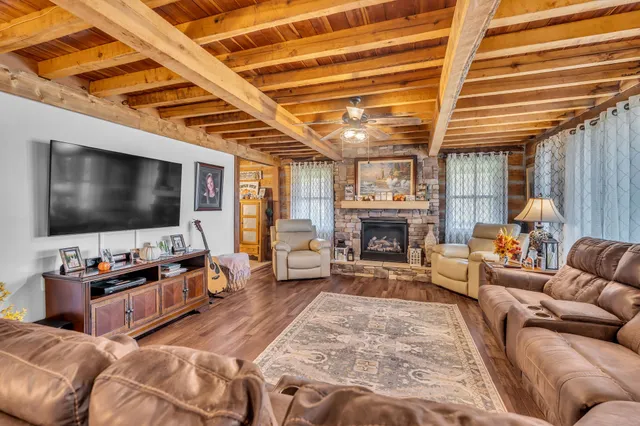a living room with furniture and a flat screen tv