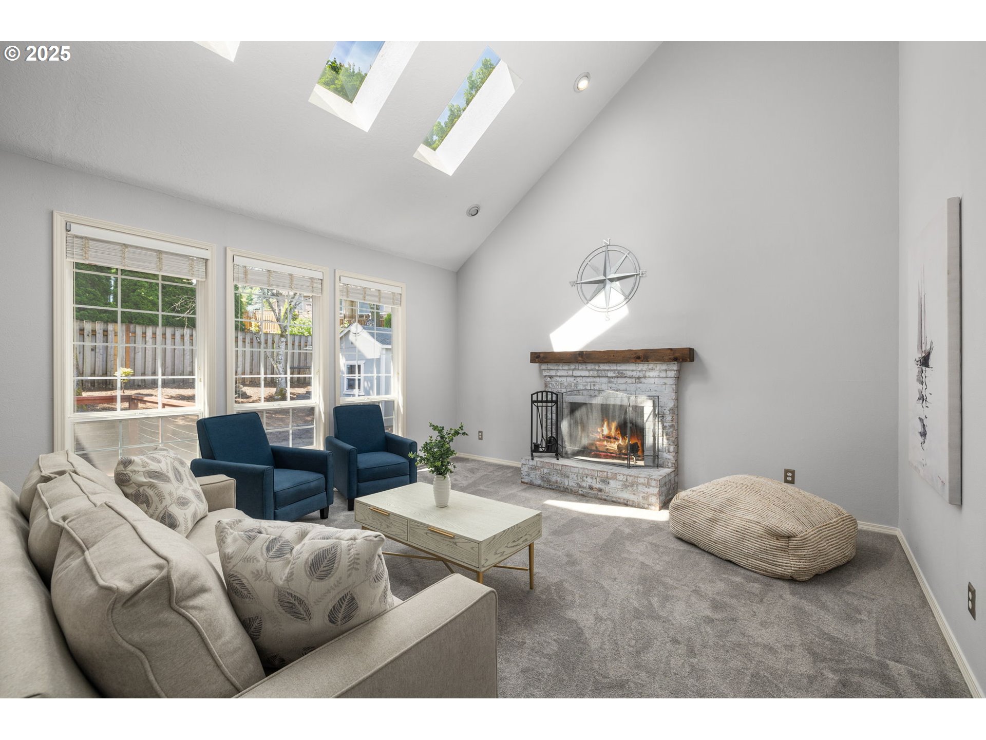 6783 Apollo Road West Linn, OR 97068 - Photo 12 of 42 a living room with furniture and a fireplace