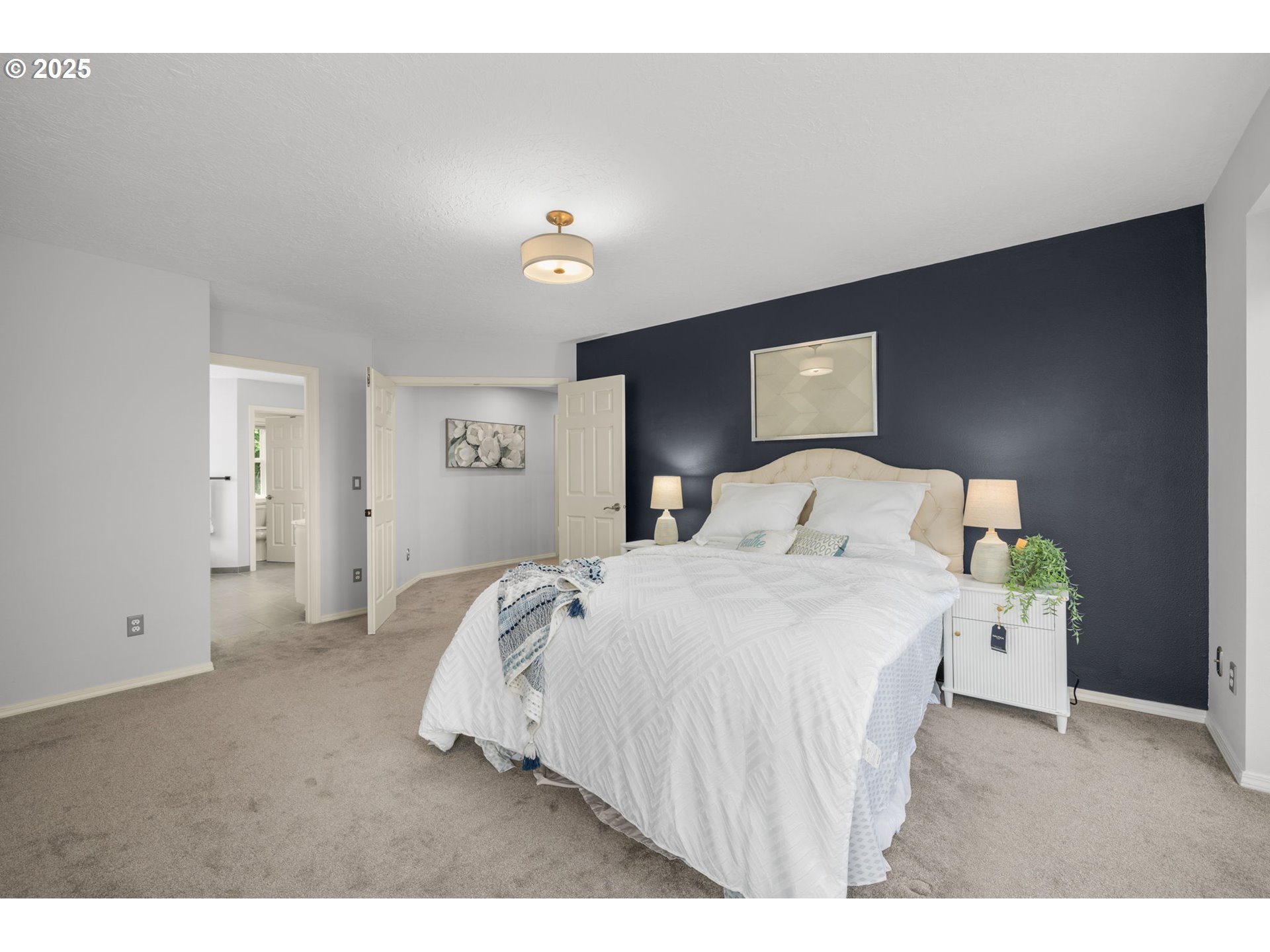 6783 Apollo Road West Linn, OR 97068 - Photo 18 of 42 a bedroom with a bed and a night stand