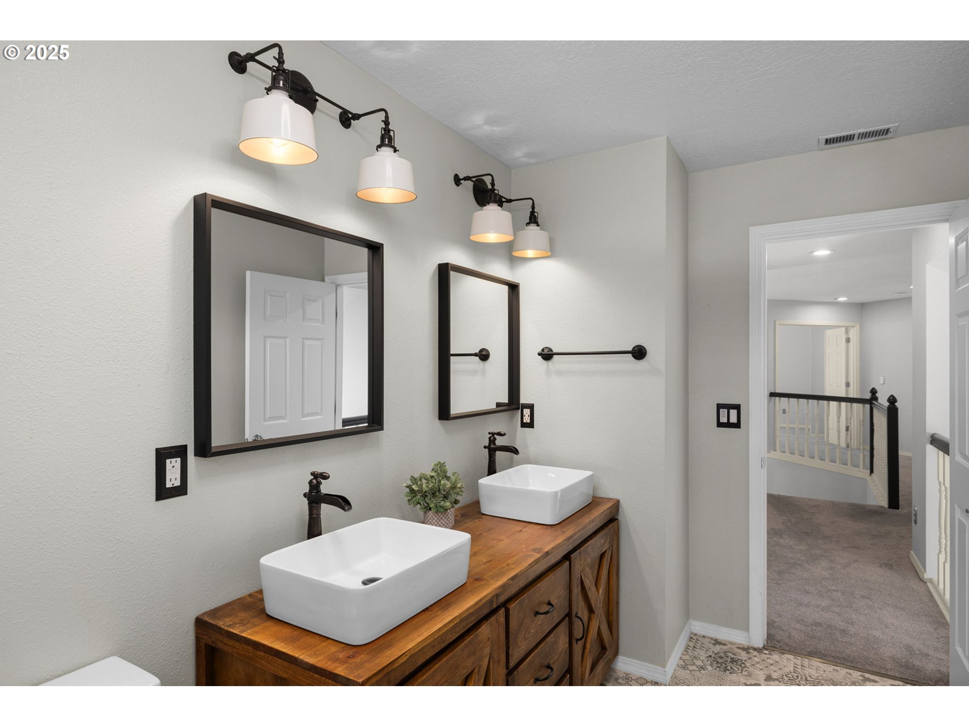6783 Apollo Road West Linn, OR 97068 - Photo 26 of 42 a bathroom with a double vanity sink mirror and