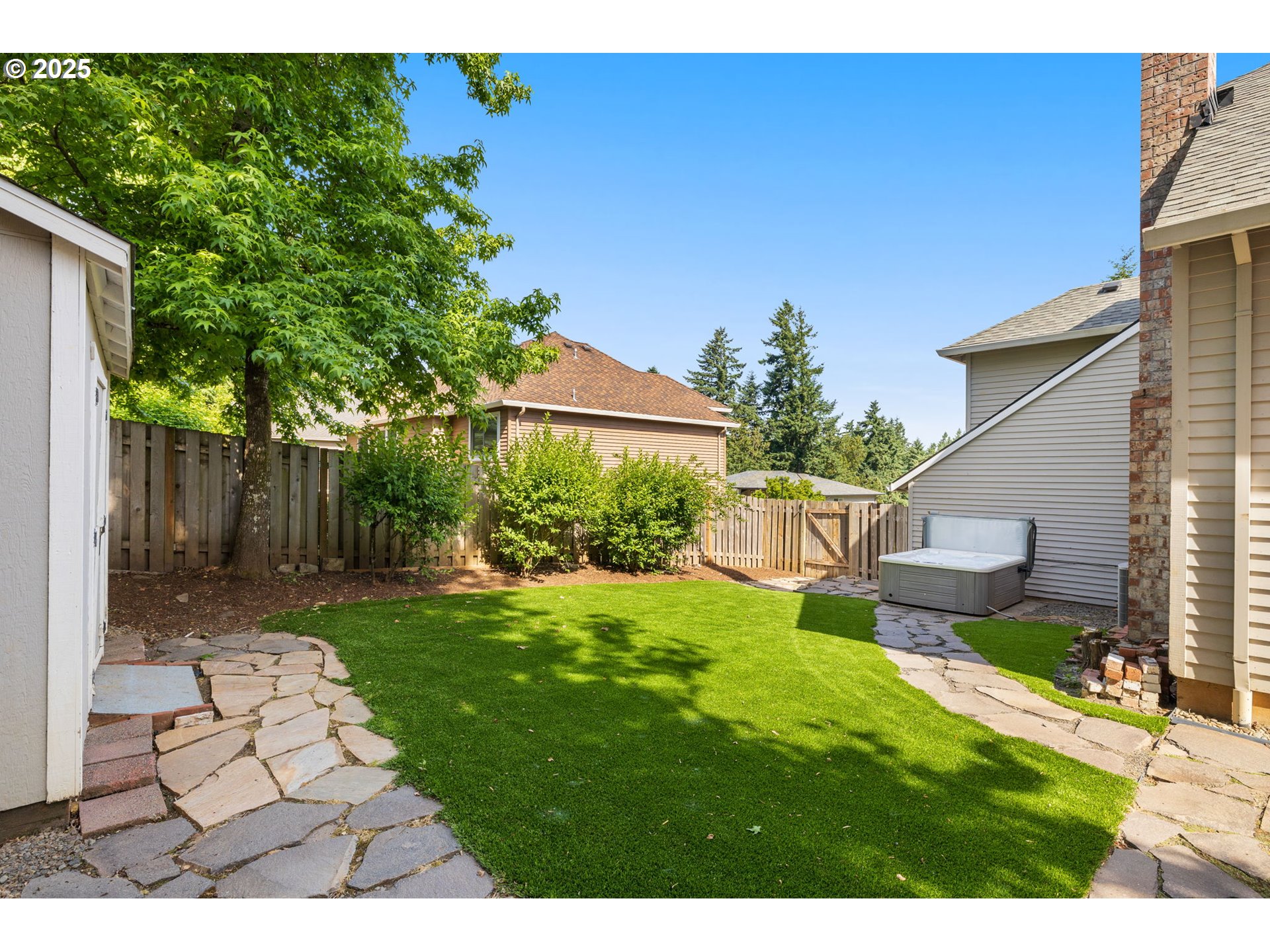 6783 Apollo Road West Linn, OR 97068 - Photo 33 of 42 a backyard of a house with seating space