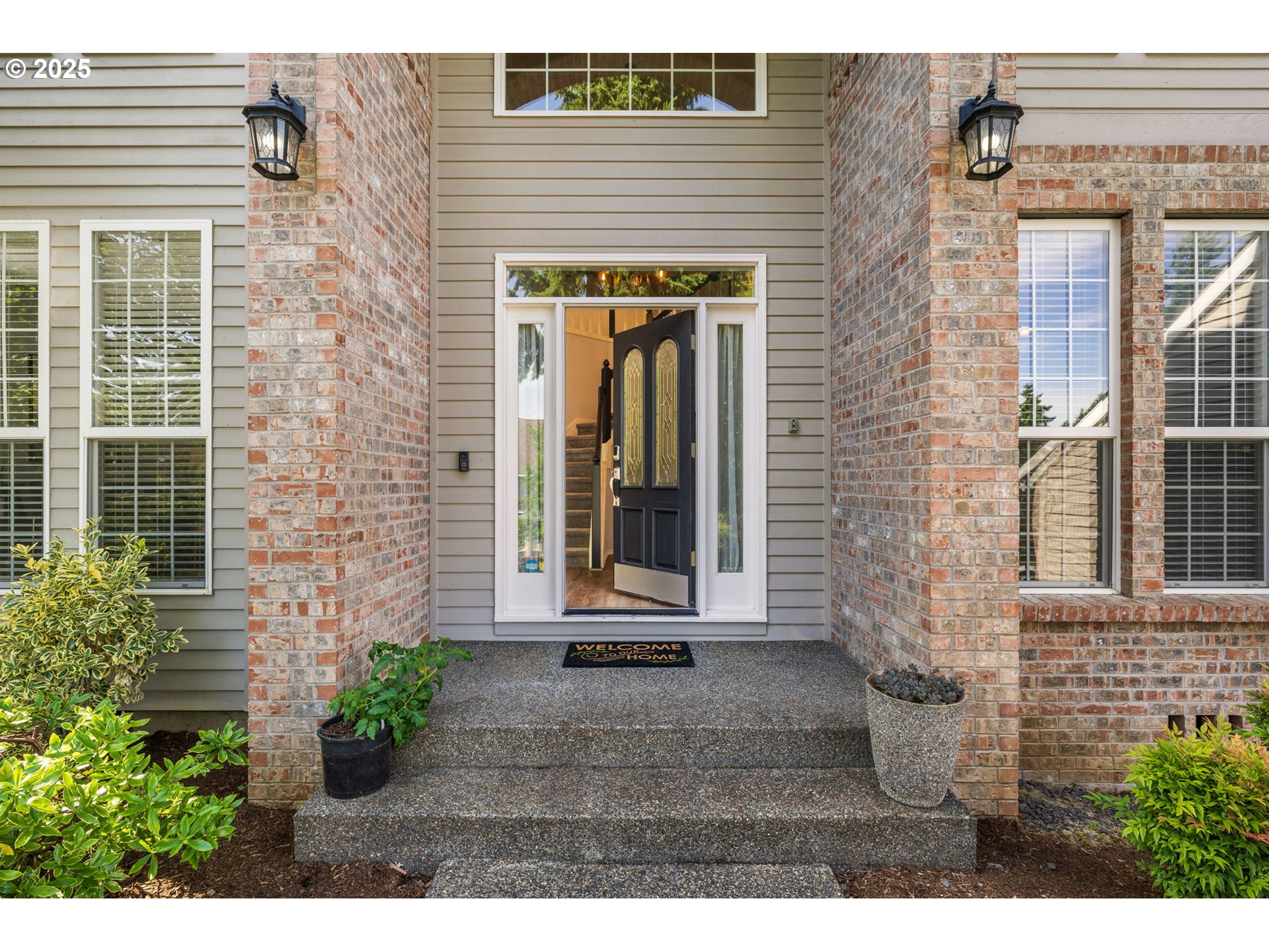 6783 Apollo Road West Linn, OR 97068 - Photo 4 of 42 a front view of a house with a yard