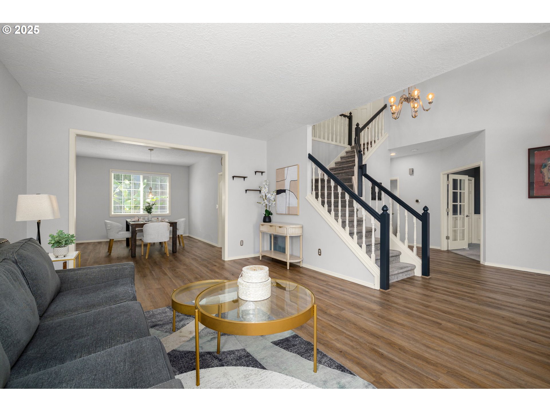 6783 Apollo Road West Linn, OR 97068 - Photo 6 of 42 a living room with furniture dining table and wooden floor