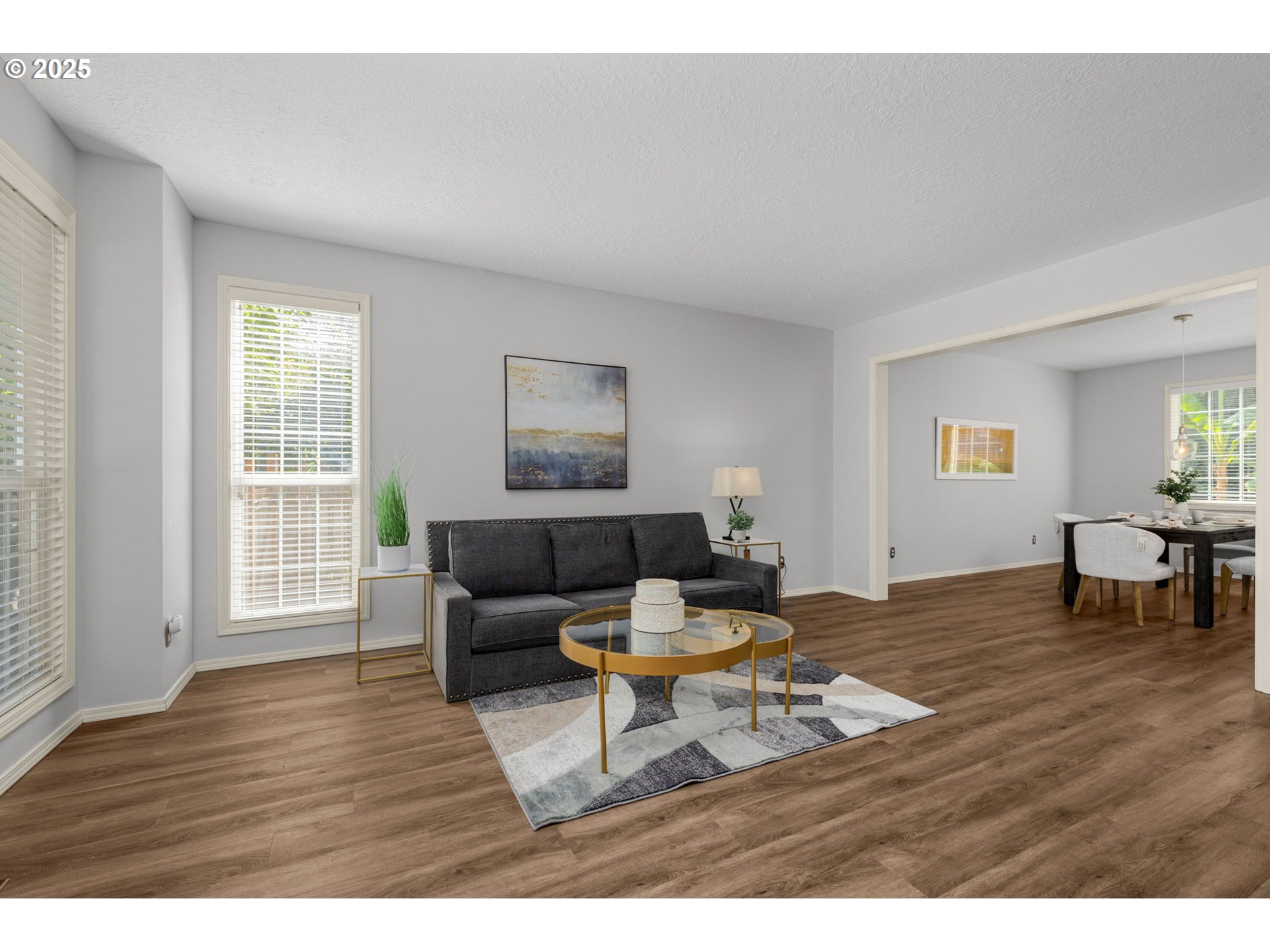 6783 Apollo Road West Linn, OR 97068 - Photo 7 of 42 a living room with furniture and a table with wooden floor