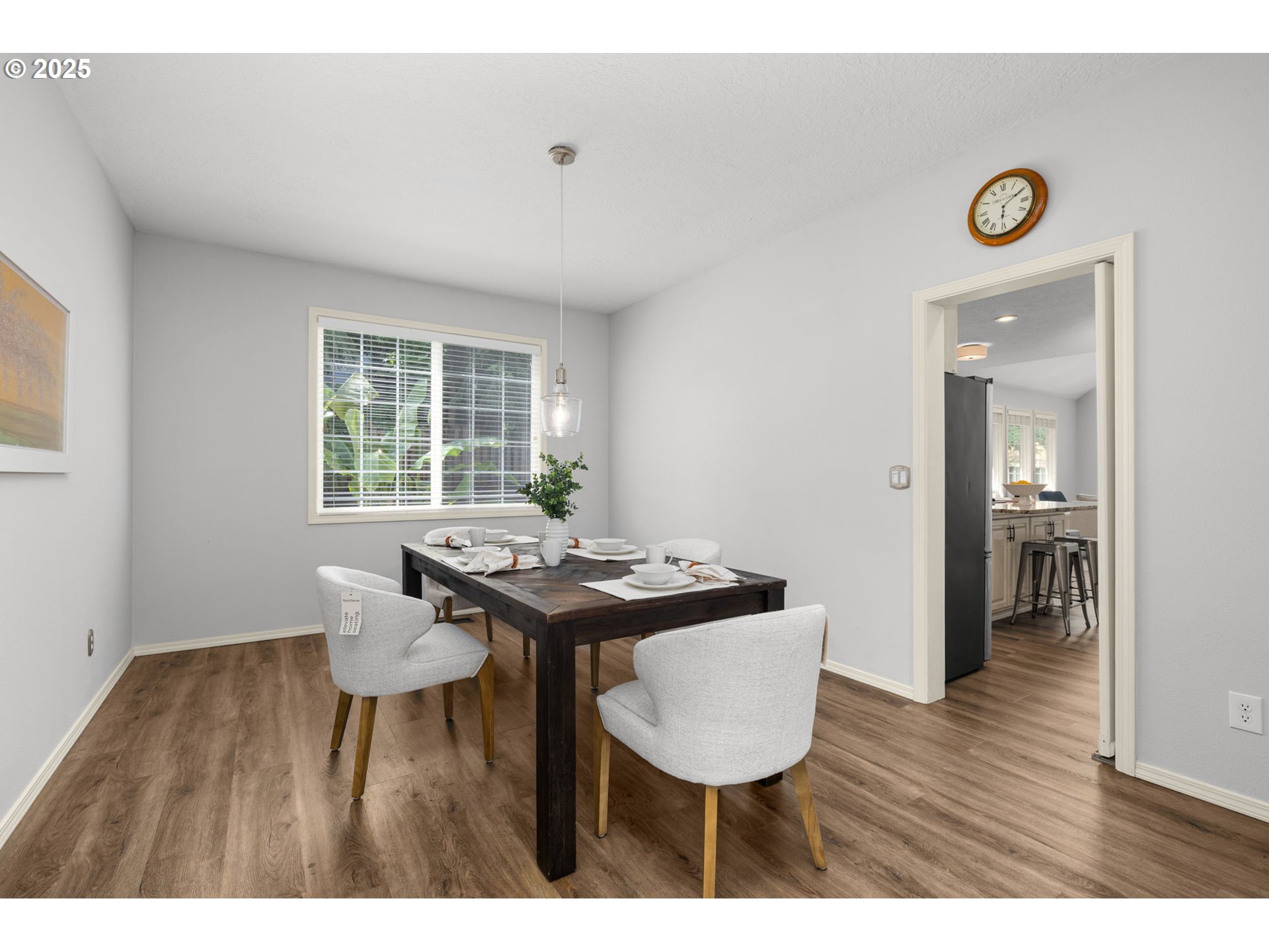 6783 Apollo Road West Linn, OR 97068 - Photo 8 of 42 a view of a dining room with furniture and wooden floor