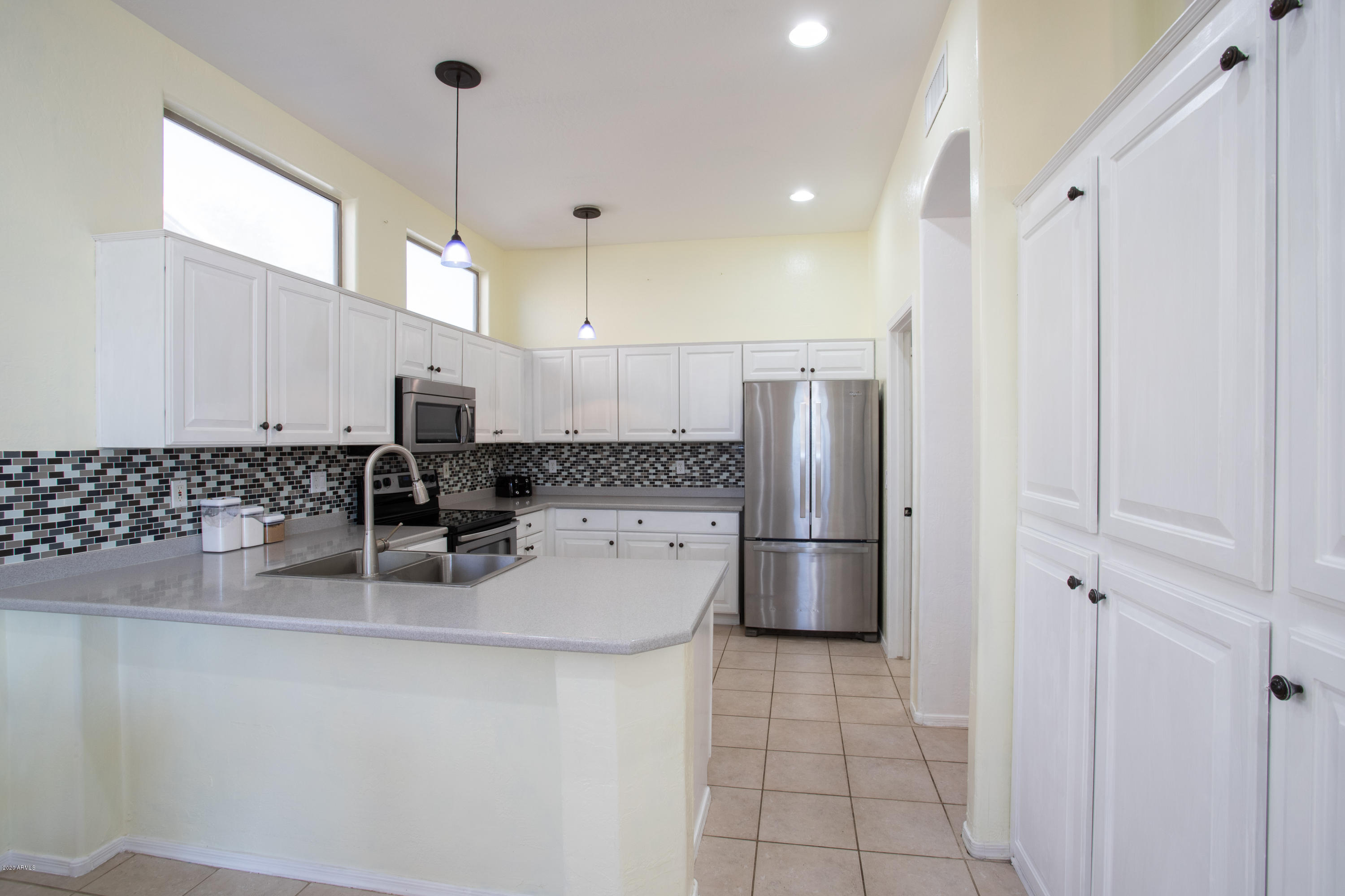 17537 West Wandering Creek Road Goodyear, AZ 85338 - Photo 2 of 8 Bright kitchen with large island