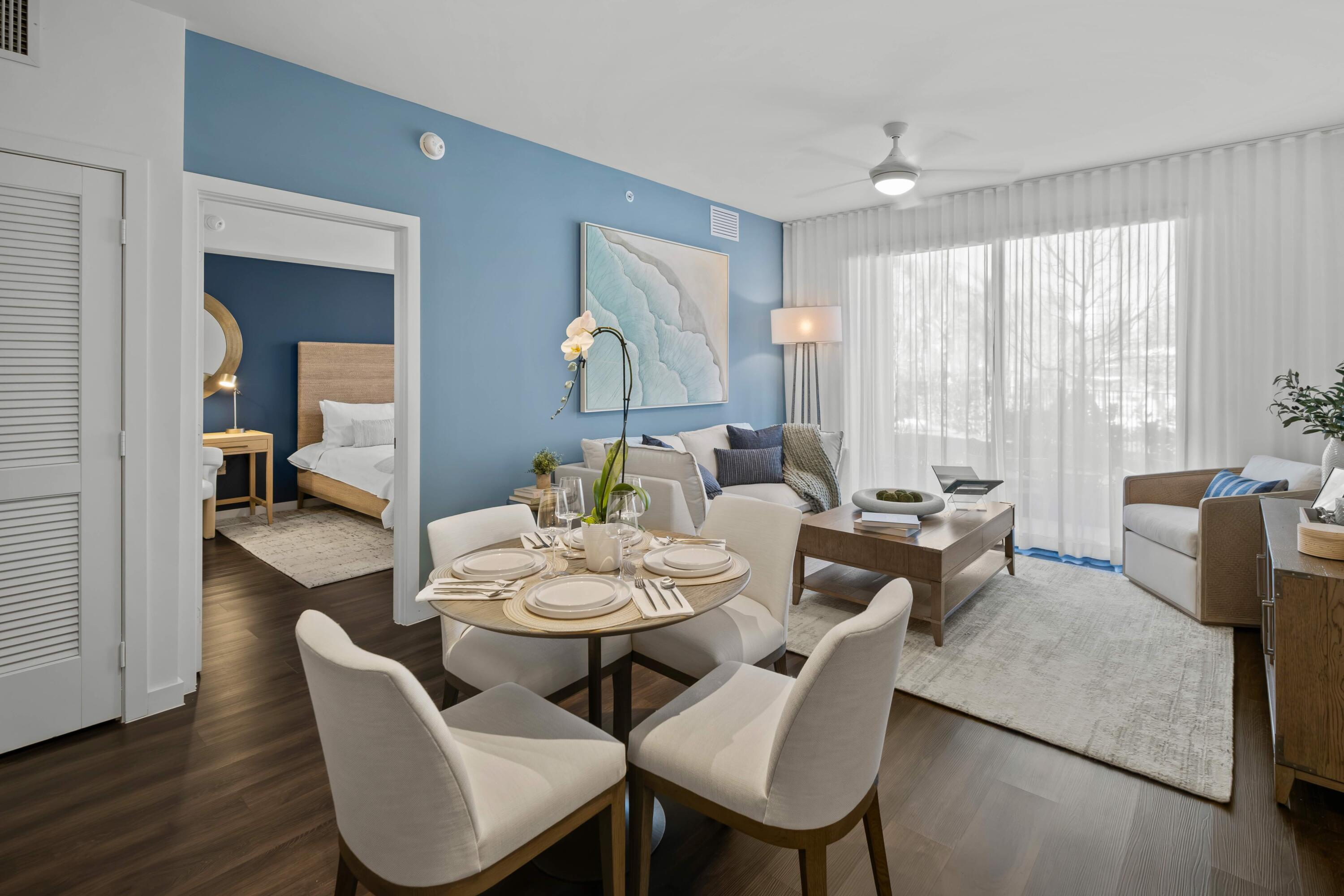 2000 Stirling Road, Unit 14103 Hollywood, FL 33020 - Photo 12 of 35 a view of a dining room with furniture and wooden floor