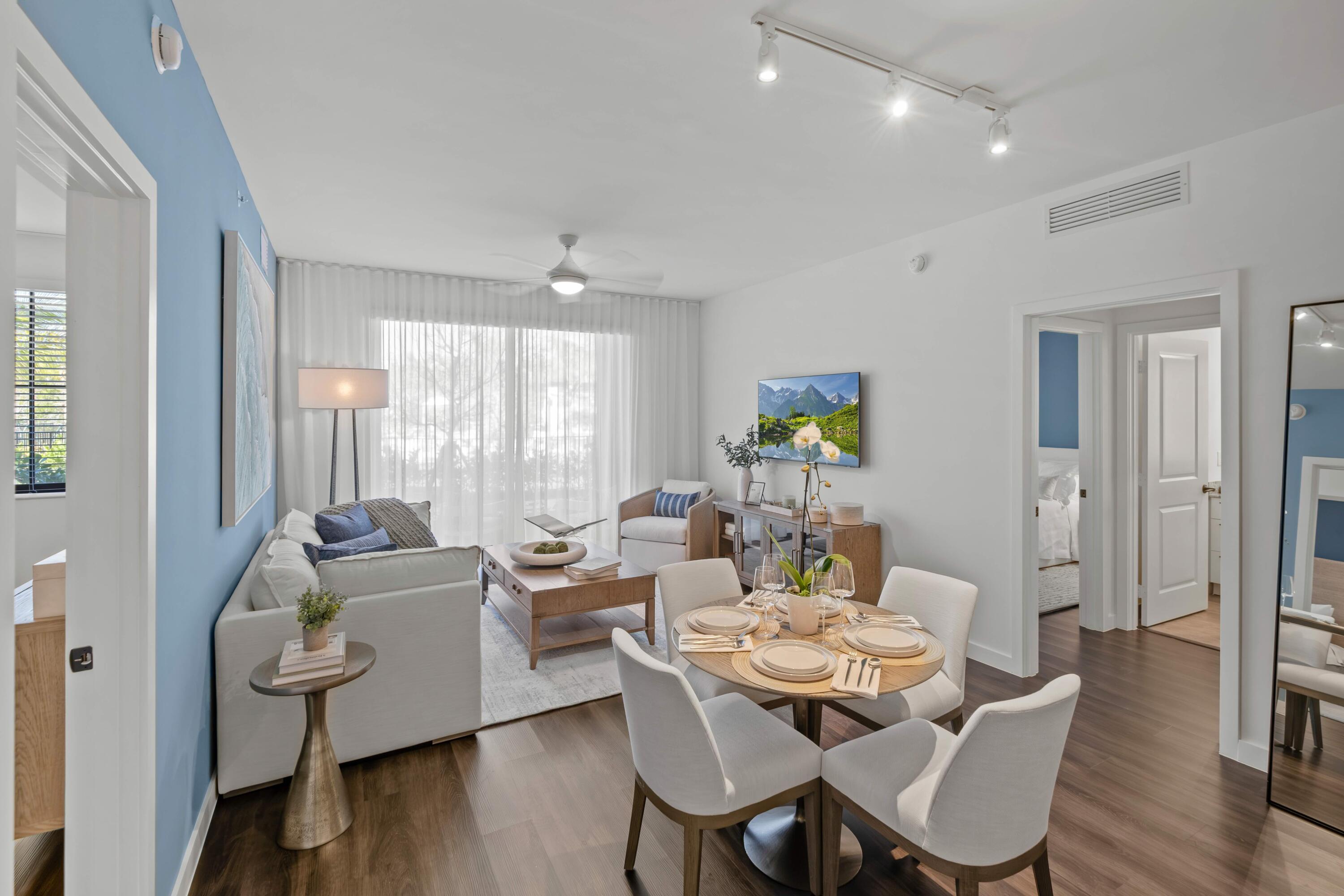 2000 Stirling Road, Unit 14103 Hollywood, FL 33020 - Photo 22 of 35 a view of a dining room with furniture and wooden floor