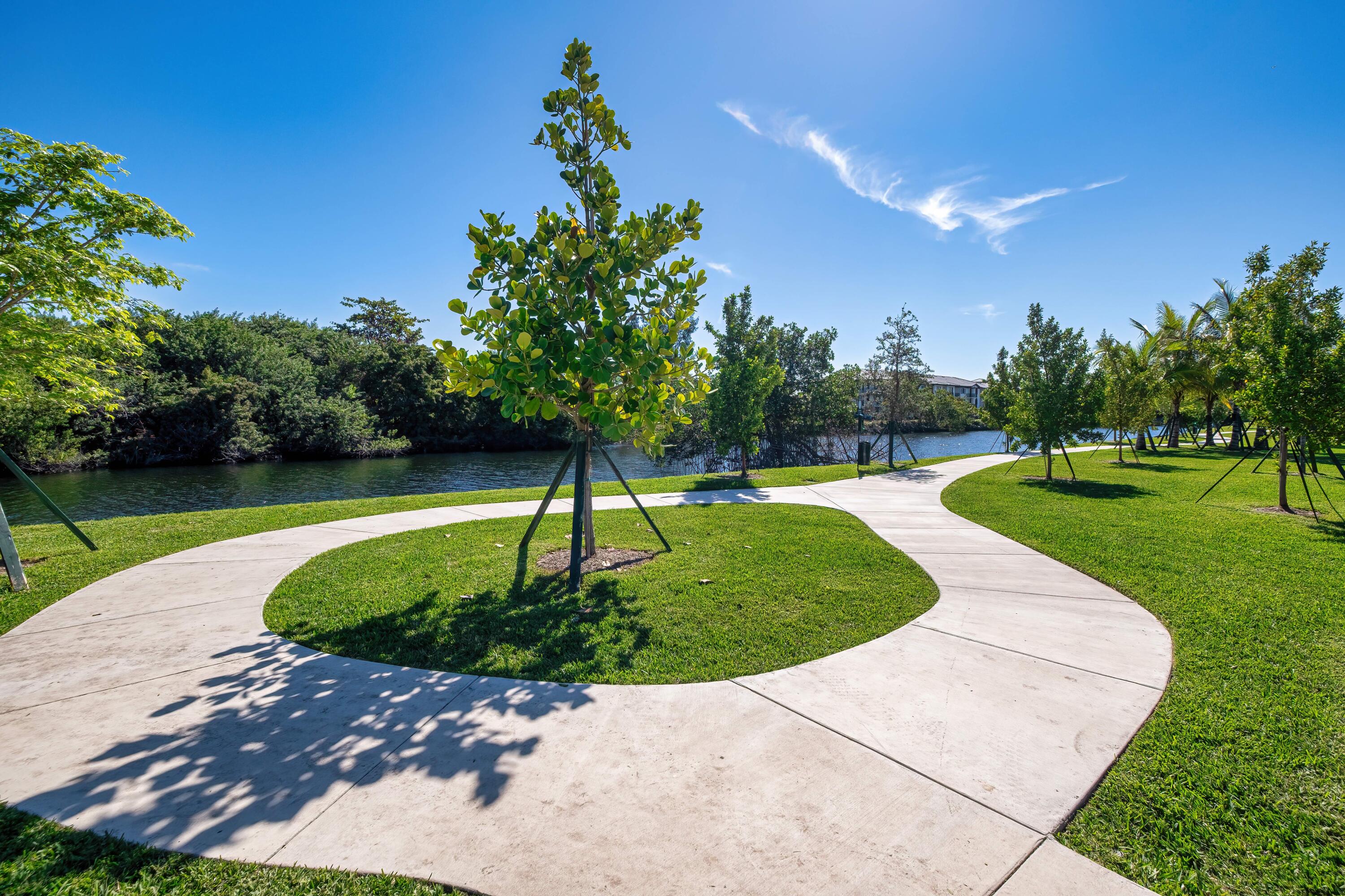 2000 Stirling Road, Unit 14103 Hollywood, FL 33020 - Photo 3 of 35 a view of a garden with a fountain