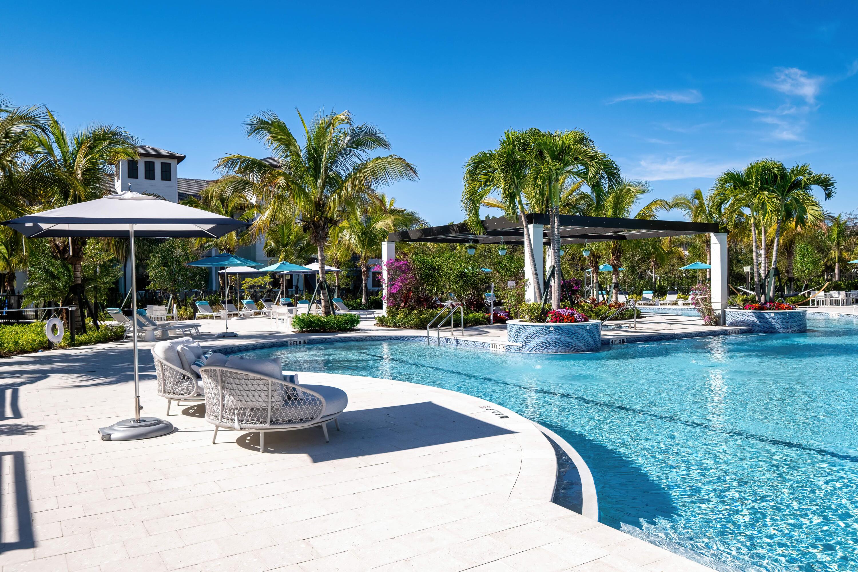 2000 Stirling Road, Unit 14103 Hollywood, FL 33020 - Photo 7 of 35 a view of a swimming pool with a patio