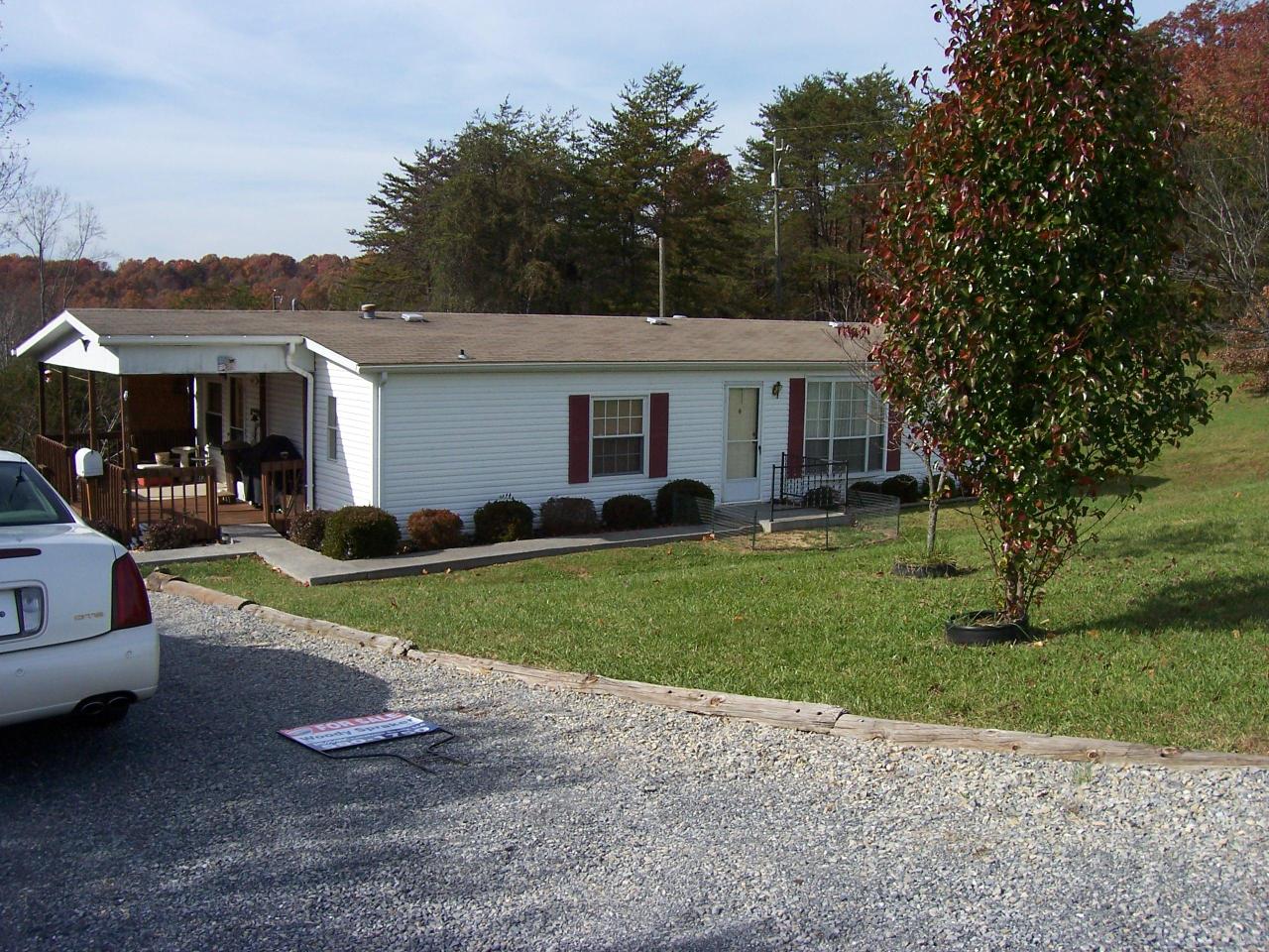 a view of a house with a back yard
