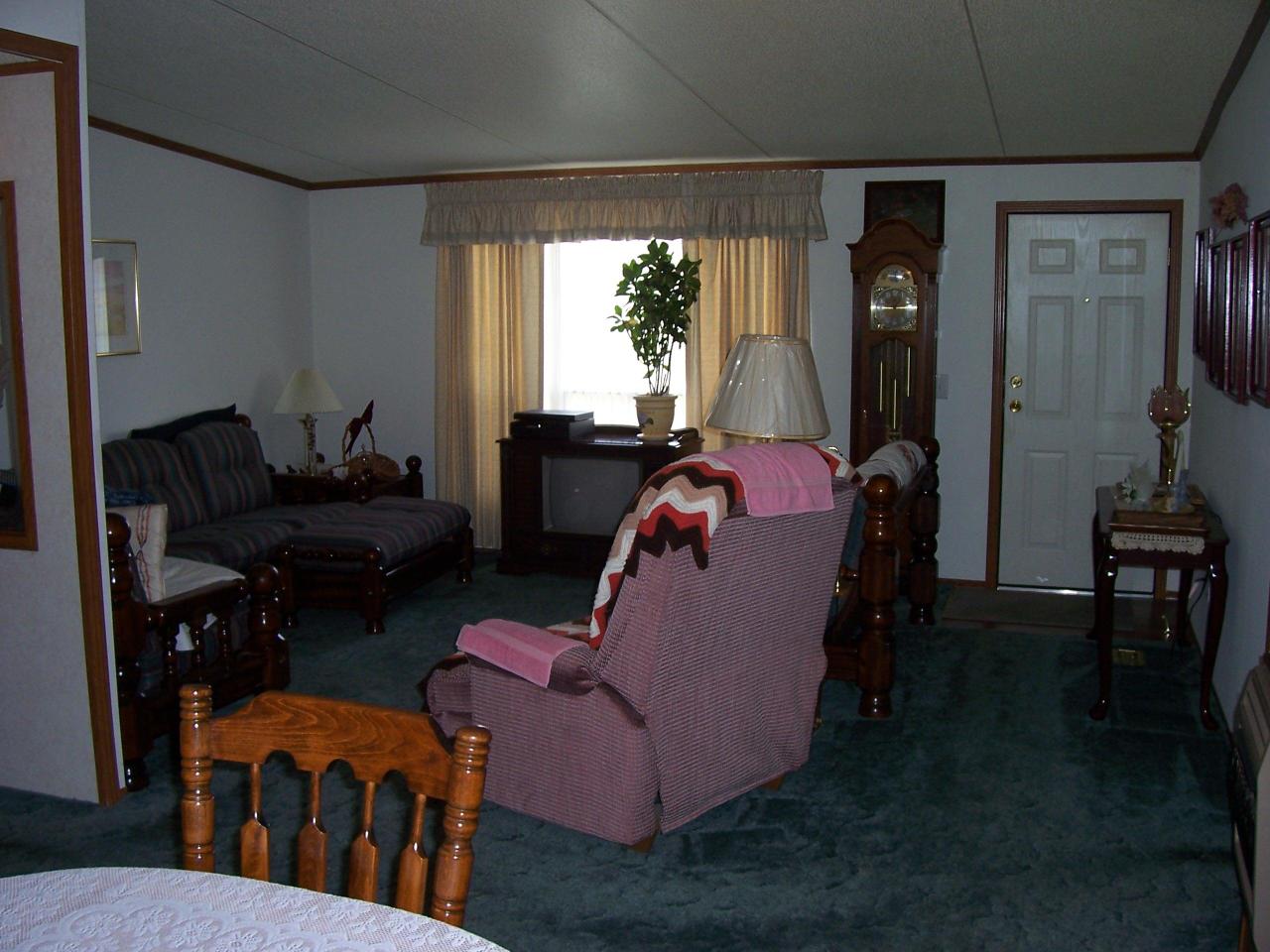 4619 Horseshoe Bend Road Goodview, VA 24095 - Photo 5 of 7 a living room with furniture and large windows
