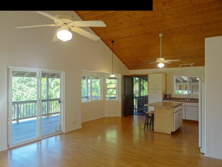 1450 Kauhikoa Road Haiku, HI 96708 - Photo 25 of 30 a view of a livingroom with furniture wooden floor and windows