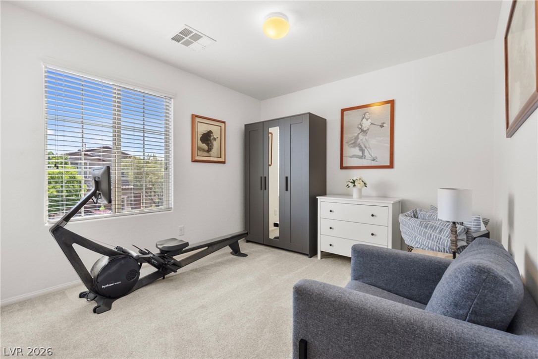 891 Earth Luster Road Las Vegas, NV 89178 - Photo 19 of 48 Bright and airy secondary bedroom offers plush carpeting and a sun-drenched window.