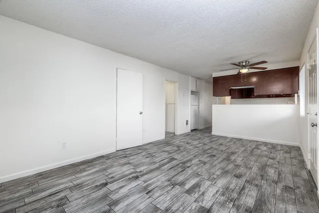 a view of a livingroom with a refrigerator