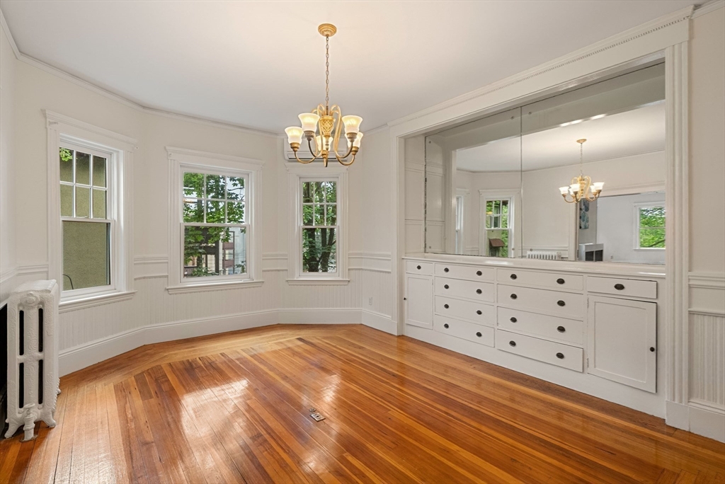 179 Rawson Road, Unit 2 Brookline, MA 02445 - Photo 13 of 42 a spacious bathroom with double vanity and a bathtub