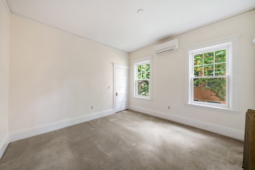 179 Rawson Road, Unit 2 Brookline, MA 02445 - Photo 21 of 42 an empty room with windows