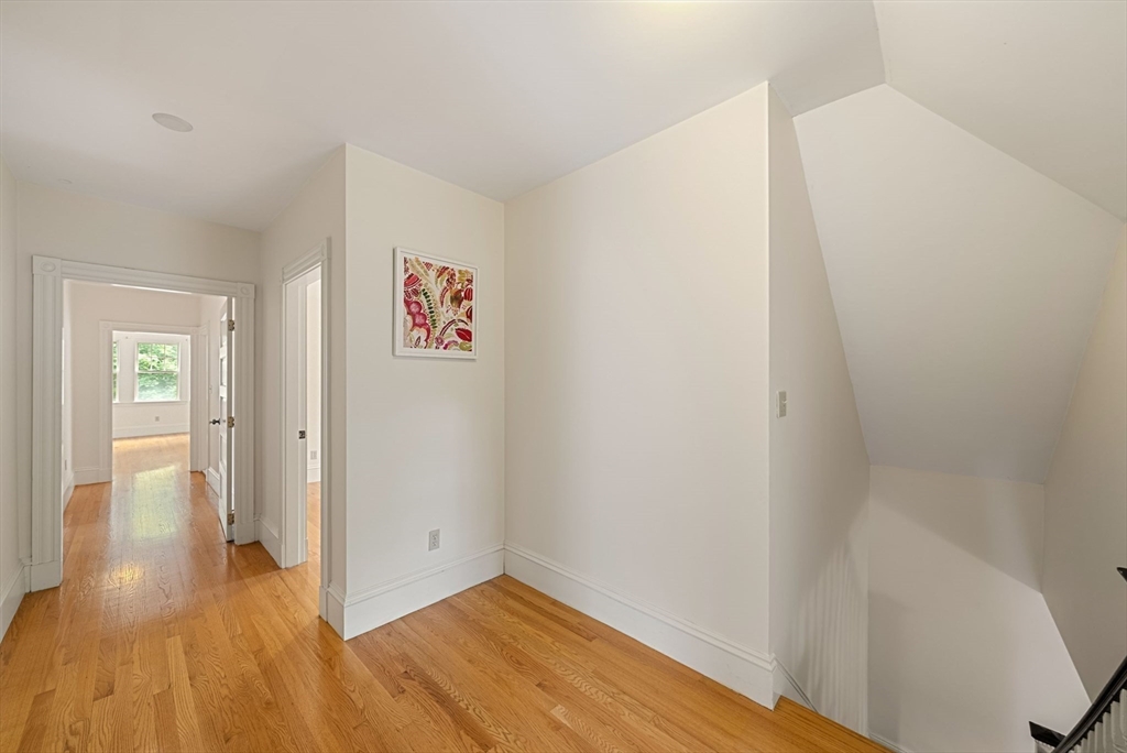 179 Rawson Road, Unit 2 Brookline, MA 02445 - Photo 28 of 42 a view of an empty room and wooden floor