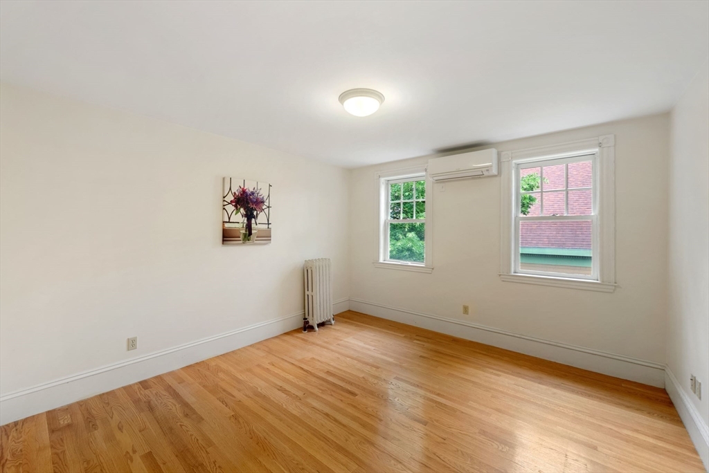 179 Rawson Road, Unit 2 Brookline, MA 02445 - Photo 30 of 42 an empty room with windows